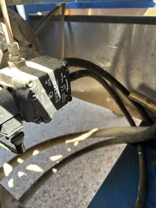 Old fuel line setup without filtration on Nilfisk DTE 500HM hot pressure washer before contaminated fuel repair in Leicester.